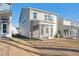 Tan house with screened porch and small yard at 501 Hanover Shore Ln, Raleigh, NC 27610