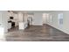 Modern kitchen with white cabinets, island, and stainless steel appliances at 501 Hanover Shore Ln, Raleigh, NC 27610