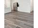 Open floor plan with stainless steel refrigerator and luxury vinyl plank flooring at 501 Hanover Shore Ln, Raleigh, NC 27610