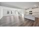 Modern kitchen featuring white cabinetry, stainless steel appliances, and an island at 501 Hanover Shore Ln, Raleigh, NC 27610