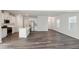 Modern kitchen with white cabinets, island, and stainless steel appliances at 501 Hanover Shore Ln, Raleigh, NC 27610
