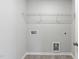 Laundry room with shelving and hookups at 501 Hanover Shore Ln, Raleigh, NC 27610