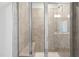 Shower with tiled walls and a built-in seat at 501 Hanover Shore Ln, Raleigh, NC 27610