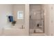 Bright bathroom featuring a soaking tub, a separate glass shower, and neutral tones at 514 Glenkirk Pl, Garner, NC 27529