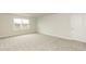 A carpeted bedroom featuring a window offering natural light at 514 Glenkirk Pl, Garner, NC 27529