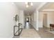 Modern foyer with sleek flooring, a console table with decorative items, and stylish lighting fixtures at 514 Glenkirk Pl, Garner, NC 27529