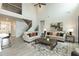 Spacious living room with high ceilings, modern decor, neutral tones, and an open floor plan at 514 Glenkirk Pl, Garner, NC 27529