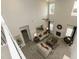 Airy living room with a fireplace, large windows, and neutral color scheme at 514 Glenkirk Pl, Garner, NC 27529