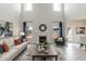 A living room featuring high ceilings, lots of natural light, a fireplace, and neutral tones at 514 Glenkirk Pl, Garner, NC 27529