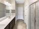 Elegant bathroom with double vanity and shower at 55 Oxer Dr, Youngsville, NC 27596
