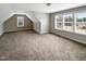 Large bonus room with carpet and windows at 55 Oxer Dr, Youngsville, NC 27596