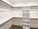 Walk in closet with shelving and rods at 55 Oxer Dr, Youngsville, NC 27596
