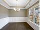 Bright dining room with hardwood floors and chandelier at 55 Oxer Dr, Youngsville, NC 27596