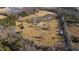 Aerial view of home, pool, pond and surrounding land at 5765 G Snow Camp Rd, Graham, NC 27253