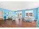Bright, beach-themed basement with living and dining areas, plus pool view at 5765 G Snow Camp Rd, Graham, NC 27253