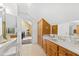 Bathroom with a large vanity, marble countertop, and access to a bedroom at 5765 G Snow Camp Rd, Graham, NC 27253