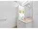 Clean bathroom with white vanity and a large mirror at 5765 G Snow Camp Rd, Graham, NC 27253