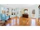 Bright bedroom with hardwood floors, built-in dresser, and access to backyard at 5765 G Snow Camp Rd, Graham, NC 27253