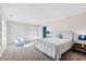 Spacious bedroom with a large bed, an armchair, and ample closet space at 5765 G Snow Camp Rd, Graham, NC 27253
