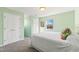 Bedroom with white double doors, a bed, and a view from the window at 5765 G Snow Camp Rd, Graham, NC 27253