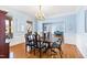 Formal dining room featuring a wood table and hardwood floors at 5765 G Snow Camp Rd, Graham, NC 27253