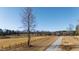 Long gravel driveway leading to home with pond views at 5765 G Snow Camp Rd, Graham, NC 27253