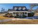 Brick home with wraparound porch, showcasing a classic design at 5765 G Snow Camp Rd, Graham, NC 27253