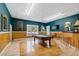 Game room features pool table, bar and wood floors at 5765 G Snow Camp Rd, Graham, NC 27253
