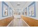 Long hallway with mirrors and wood paneling at 5765 G Snow Camp Rd, Graham, NC 27253