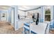 White kitchen with stainless steel appliances and breakfast area at 5765 G Snow Camp Rd, Graham, NC 27253