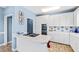 White kitchen with double ovens and cooktop at 5765 G Snow Camp Rd, Graham, NC 27253