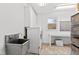 Laundry room with utility sink, washer, dryer and storage at 5765 G Snow Camp Rd, Graham, NC 27253