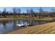 Serene pond with gazebo and dock, offering peaceful views at 5765 G Snow Camp Rd, Graham, NC 27253