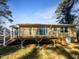 Elevated deck with stairs leading to the backyard at 6307 Tryon Rd, Cary, NC 27518