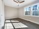 Bedroom with two large windows and hardwood floors at 6307 Tryon Rd, Cary, NC 27518