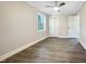 Bright bedroom featuring hardwood floors and neutral decor at 6307 Tryon Rd, Cary, NC 27518