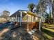 Ranch style home with deck and steps leading to the backyard at 6307 Tryon Rd, Cary, NC 27518