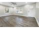 Bright living room featuring hardwood floors and lots of natural light at 6307 Tryon Rd, Cary, NC 27518