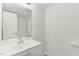 This bathroom includes a single sink vanity and an expansive mirror at 642 Pine Ridge Pl, Raleigh, NC 27609