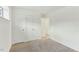 Bright bedroom with neutral carpet, white walls, two closets and a window; ready for personalization at 642 Pine Ridge Pl, Raleigh, NC 27609