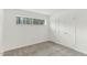 This bedroom features neutral carpet, white walls and a double door closet at 642 Pine Ridge Pl, Raleigh, NC 27609