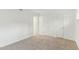 This bedroom features neutral carpet, white walls and a double door closet at 642 Pine Ridge Pl, Raleigh, NC 27609