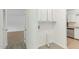 A laundry room next to a kitchen with stainless steel appliances at 642 Pine Ridge Pl, Raleigh, NC 27609