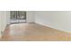 Bright and airy living space with light wood floors, white walls and sliding glass door to the outside at 642 Pine Ridge Pl, Raleigh, NC 27609