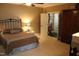 Guest bedroom with antique wardrobe and access to hallway at 7115 Laurel Point Dr, Gibsonville, NC 27249