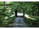 Road leading to house via a charming covered bridge at 7115 Laurel Point Dr, Gibsonville, NC 27249