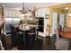 Modern kitchen with island, stainless steel appliances, and dark hardwood floors at 7115 Laurel Point Dr, Gibsonville, NC 27249