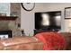 Relaxing living room with stone fireplace and large TV at 7115 Laurel Point Dr, Gibsonville, NC 27249