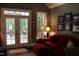 Cozy living room with French doors leading to a patio at 7115 Laurel Point Dr, Gibsonville, NC 27249