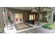 Covered patio with brick flooring and seating at 7115 Laurel Point Dr, Gibsonville, NC 27249